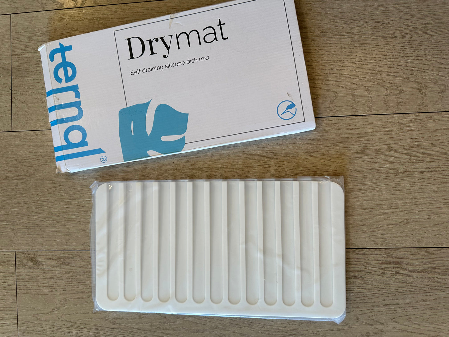 Self drain dry mat